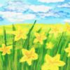 A field of yellow flowers and green grass blades fades off into a yellow meadow. There is a bright blue sky with white clouds in the background.